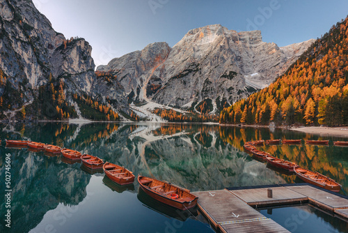 A quiet morning at Lago di Braies in the Italian Dolomites. The autumn mood of the photo creates a great atmosphere. photo