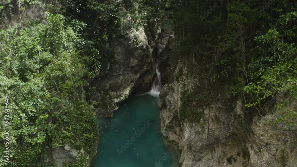 Aerial dolly out shot of a grotto and waterfall in the Balneario Mata de Maiz. Aerial dolly out shot of a grotto and waterfall in the Balneario Mata de Maiz.