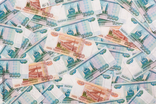Russian money face value of one and five thousand rubles. Close-up of Russian rubles background and texture