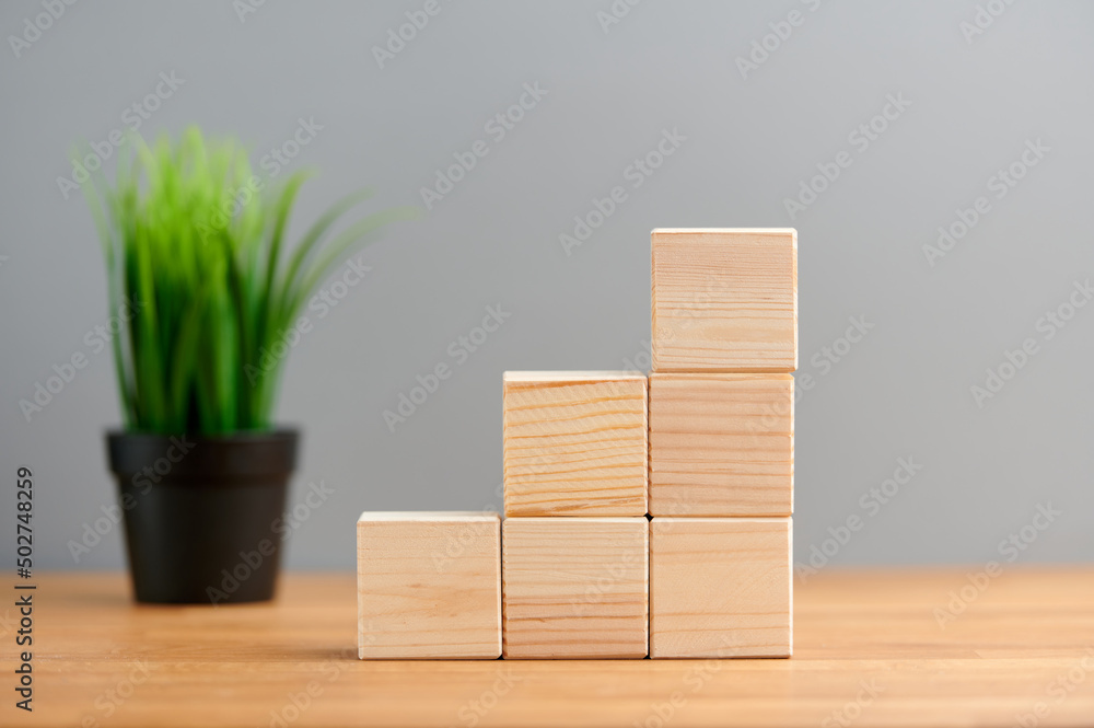 Ecology, business, seo, team, advertise concept, blank wooden block cubes on a gray background with plant for your text and advertisement. Free space for business concept template and banner.. Ecology, business, seo, team, advertise concept, blank wooden block cubes on a gray background with plant for your text and advertisement. Free space for business concept template and banner..
