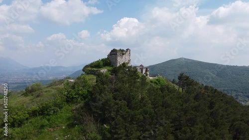 Ancient Norman Castle with the Sanctuary of Maria SS. della Misericordia, located on the chain of the Tifatini Mountains, southern Italy. Castel Morrone, Italy, May 04, 2022. photo