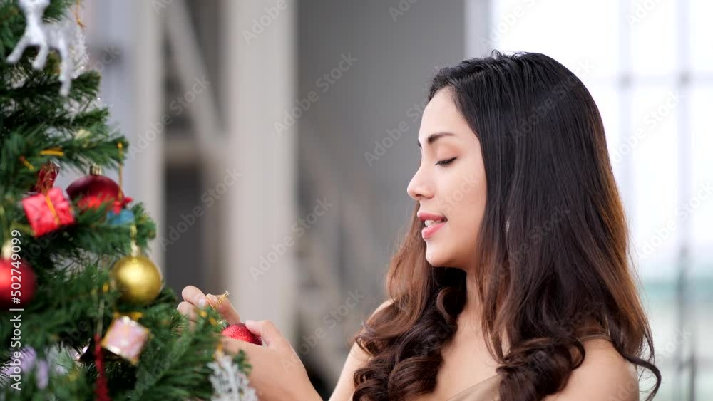 Two Asia women decorated Christmas tree Two Asia women decorated Christmas tree