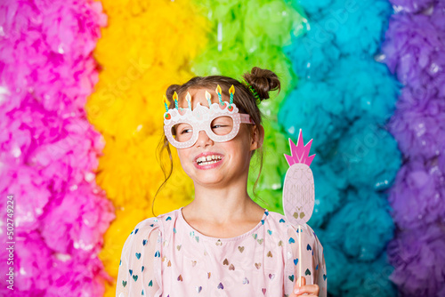 Photography Cute girl celebrating birthday, wearing party paper glasses, laughing and having fun