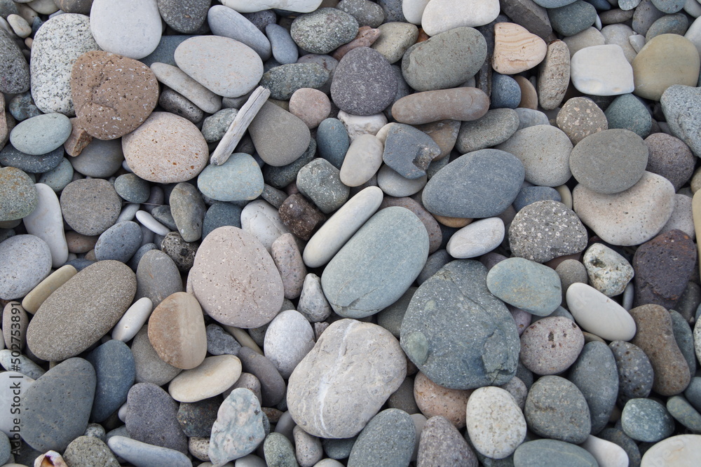 Grey stones, pebbles background, flat stones Grey stones, pebbles background, flat stones