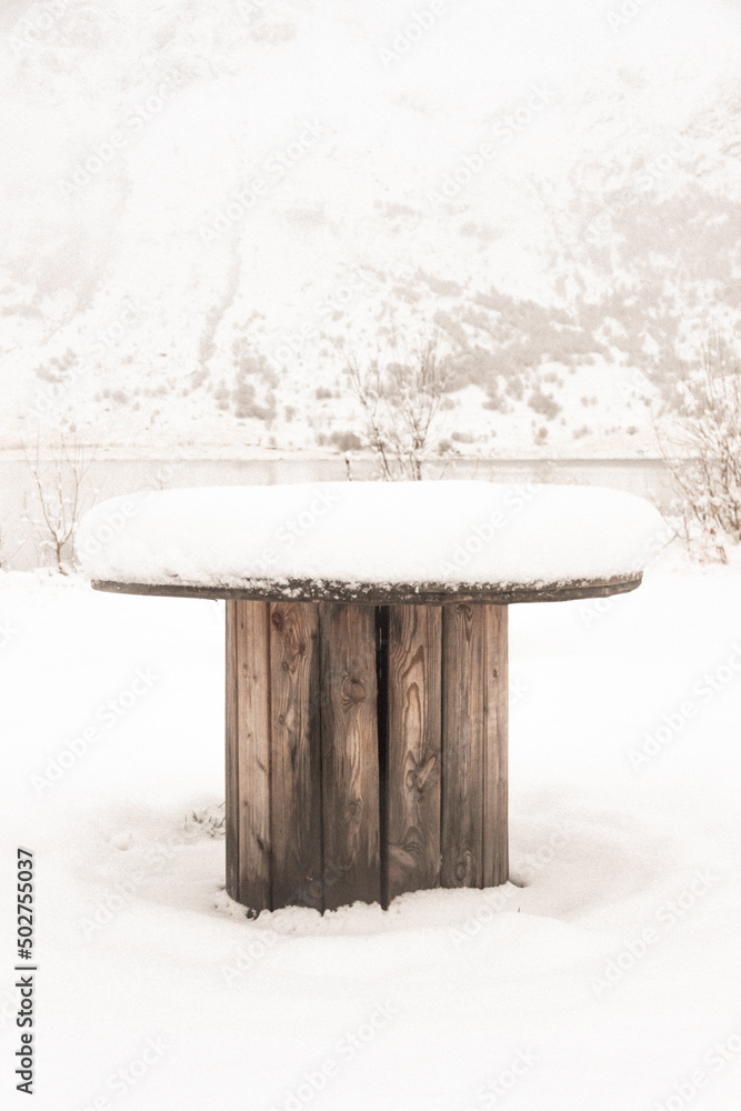 Wooden table in the Snow in Lofoten norway Wooden table in the Snow in Lofoten norway