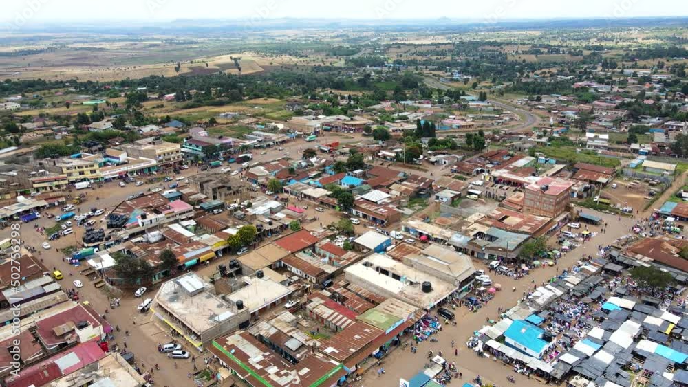 Aerial view of cars and people at a Open Air Market, in Africa - reverse, drone shot Aerial view of cars and people at a Open Air Market, in Africa - reverse, drone shot