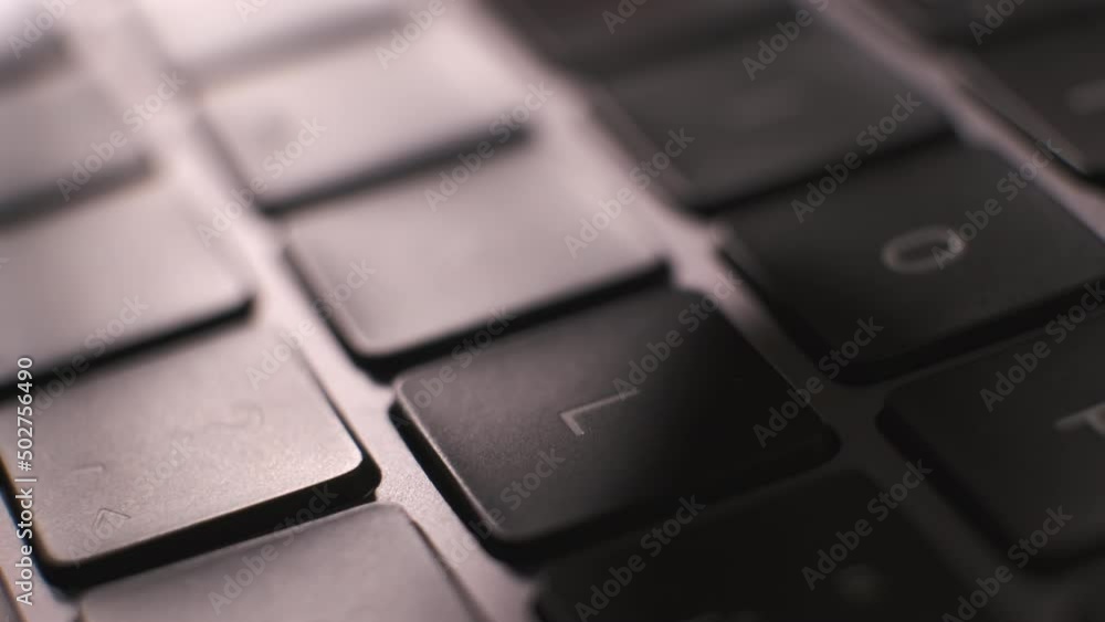 Close up man typing on the black keyboard. Freelance working on his laptop. Close up man typing on the black keyboard. Freelance working on his laptop.