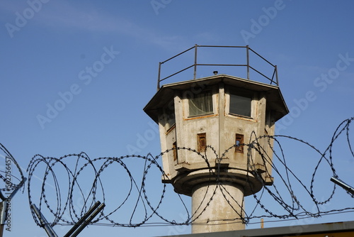 Berlin, watchtower and barbed wire. photo