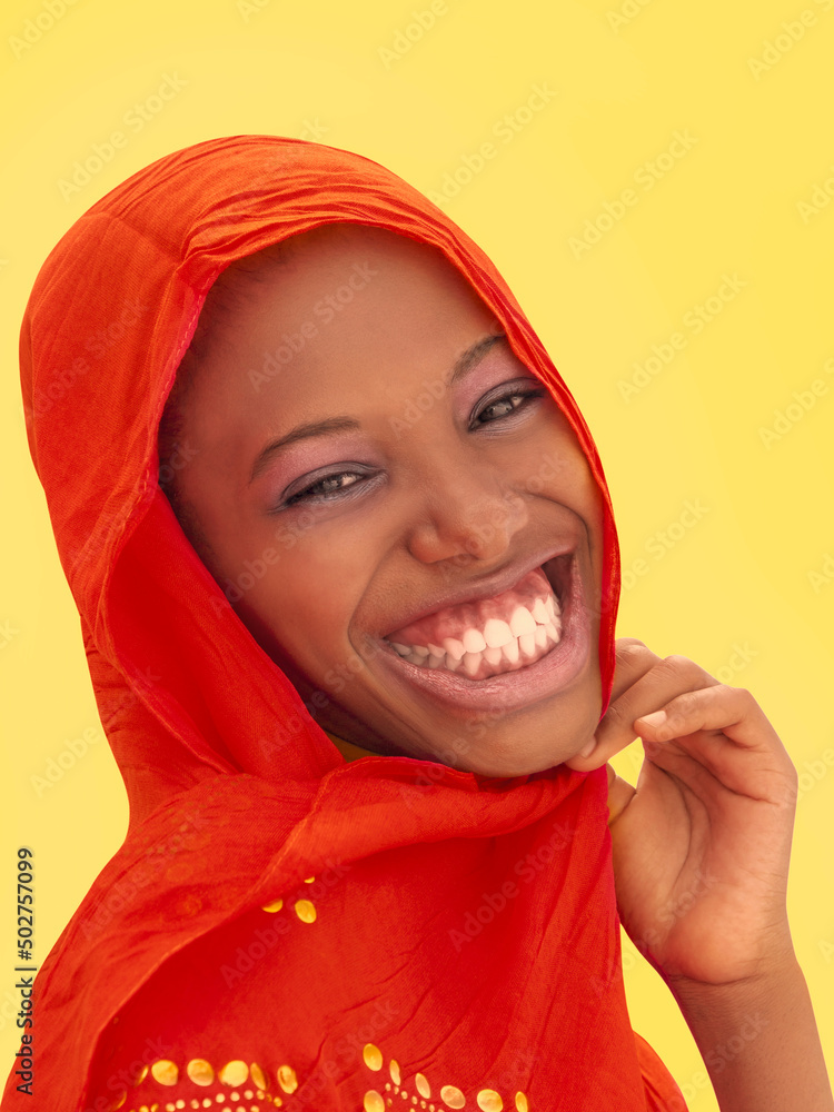 Beautiful girl laughing and wearing a red headscarf, 18 years old, isolated (cut out), yellow background, photo Beautiful girl laughing and wearing a red headscarf, 18 years old, isolated (cut out), yellow background, photo