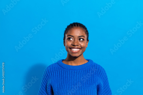 Portrait of attractive cheerful brunette curious girl making decision copy space isolated over vibrant blue color background