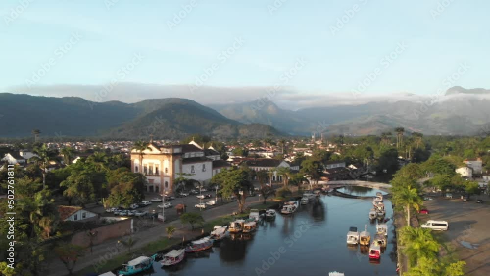 Aerial View Over Colorful Houses In The Town With The Mountains Aerial View Over Colorful Houses In The Town With The Mountains