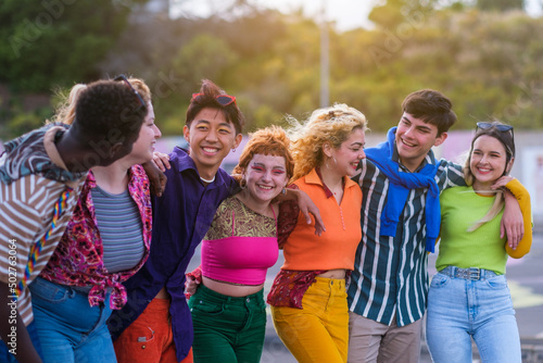 Group of young friends with makeup and colorful clothes