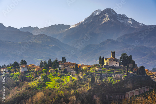 Barga town and Alpi Apuane mountains in winter. Garfagnana, Tuscany, Italy.