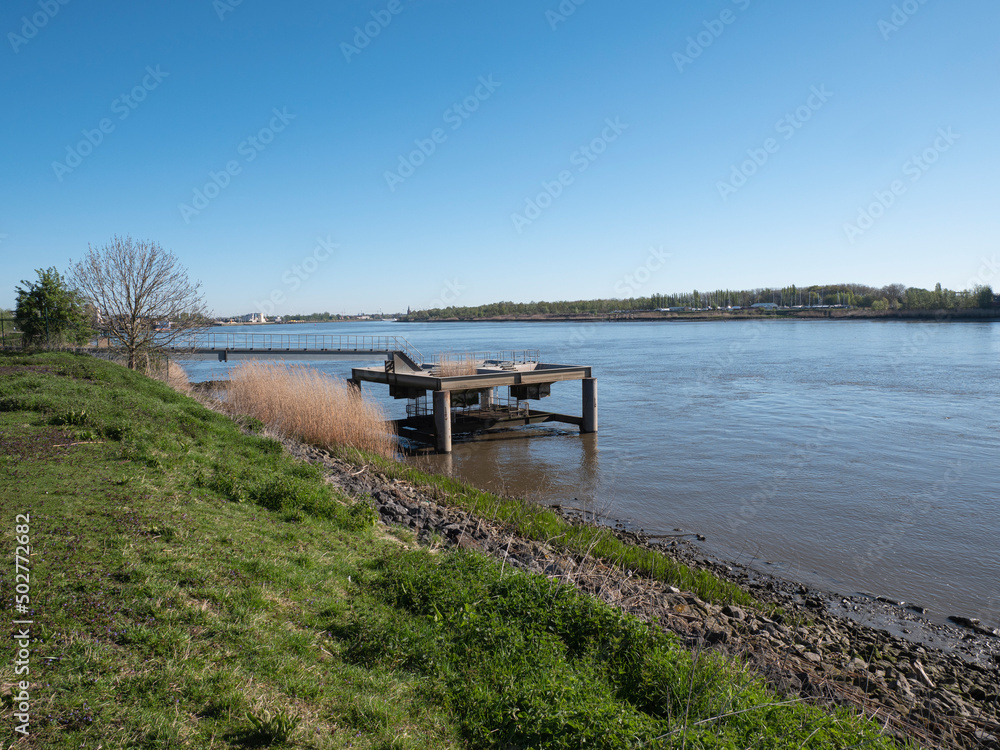 Landscape photo with a view of the river Scheldt from the village of Kruibeke located in the northeast of the Belgian province of East Flanders