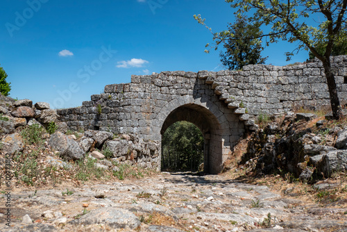 Muralha do castelo e antiga vila amuralhada de Ansiães com o portão de São Salvador à frente em Trás os Montes, Portugal photo