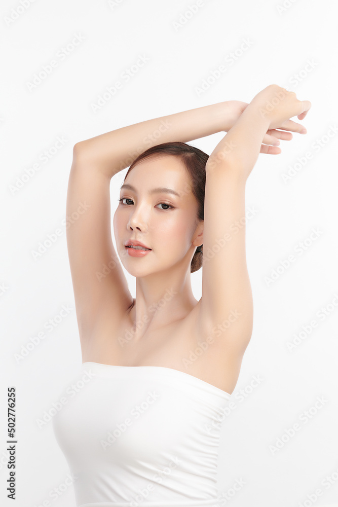 Beautiful Young Asian woman lifting hands up to show off clean and hygienic armpits or underarms on white background, Smooth armpit cleanliness and protection concept Beautiful Young Asian woman lifting hands up to show off clean and hygienic armpits or underarms on white background, Smooth armpit cleanliness and protection concept