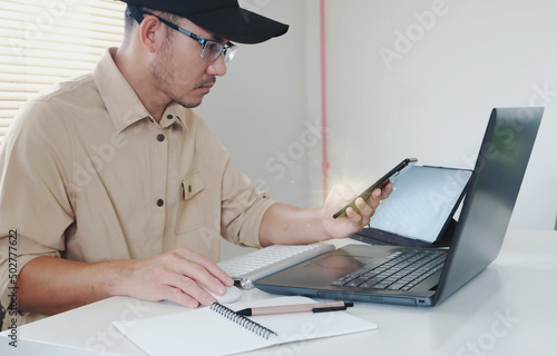 Closeup of a businessman or student typing on a computer keyboard at home, online learning, internet marketing, working from home, office workplace, freelancing concept