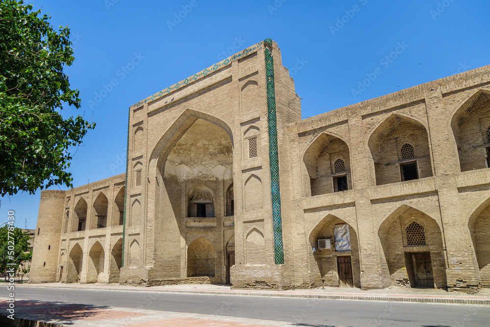 Facade of Mullo Tursunjon Madrasah, Bukhara, Uzbekistan. Structure was built in the XVI century in the traditions of Bukhara architecture. UNESCO object