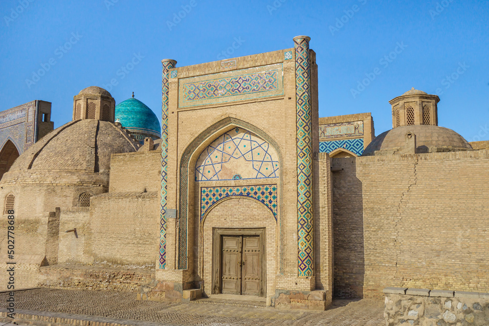 Facade of the Amir Alim Khan Madrasah, Bukhara, Uzbekistan. One of the last monuments of the Emirate of Bukhara, built in 1915. Now it is a public library
