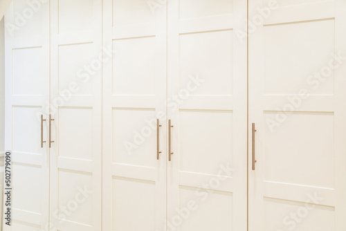 White doors of wardrobe at home photo
