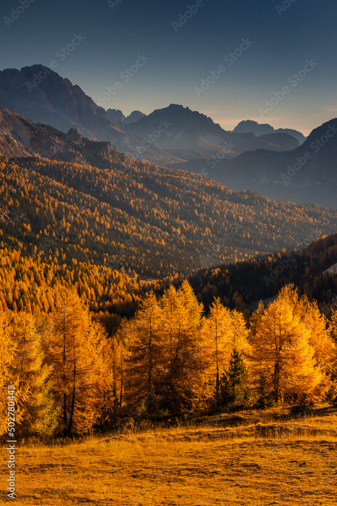 Autumn in the Italian Dolomites. The most beautiful time of the year to visit this place. Beautiful colors and breathtaking views. Mountain peaks above the valleys.