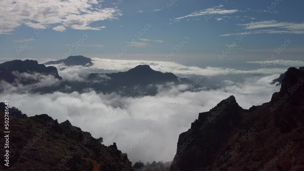 Looking down as the clouds swirl around the rocks. Real time. Looking down as the clouds swirl around the rocks. Real time.