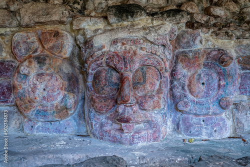 Stucco mask of the mayan Sun God, Kinich Ahau, in the temple of the masks - ancient city Edzna, Campeche, Mexico photo