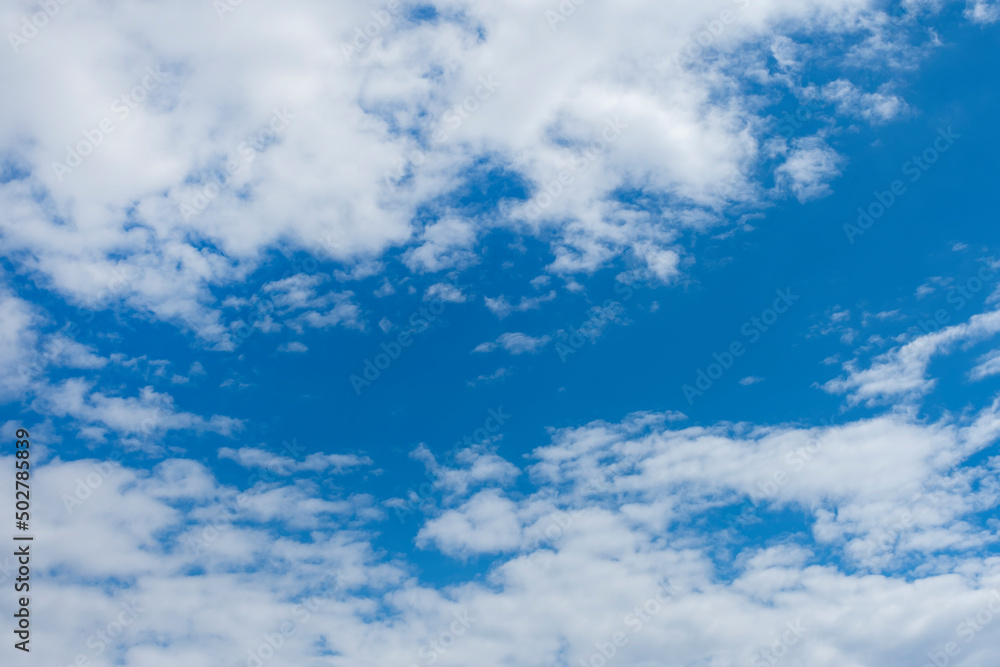 Fototapeta premium Blue sky with white clouds. Heavenly landscape background.