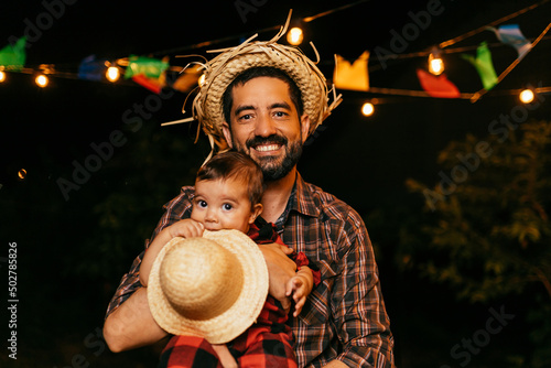 Portrait of father and baby son during the typical Brazilian Festa Junina photo