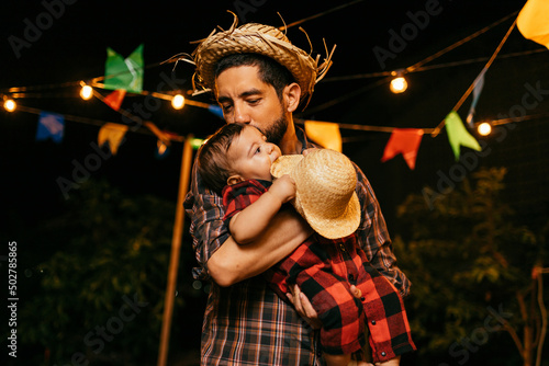 Portrait of father and baby son during the typical Brazilian Festa Junina