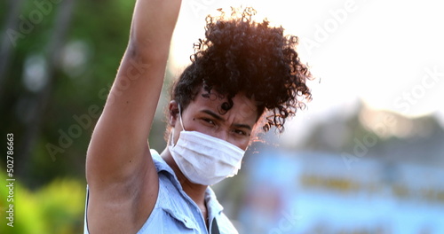 Fotografie, Obraz African American woman raises fist in air in political movement, black person ac