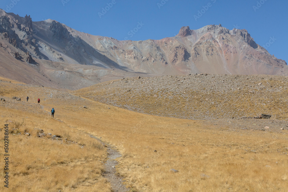 A group of tourists climb Mount Ergies, also known as Argaeus, is a volcano in Turkey