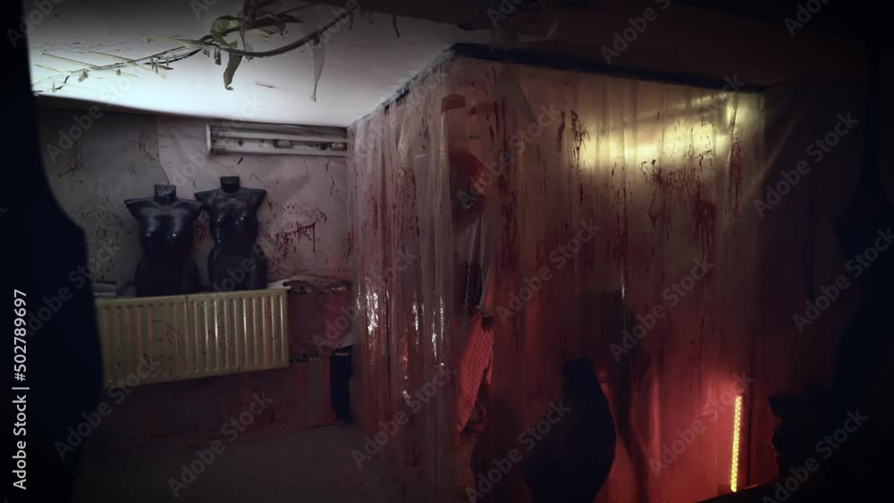 Crazy maniac in a clown costume in his bloody lair. Terrible image from nightmares. Crazy maniac in a clown costume in his bloody lair. Terrible image from nightmares.