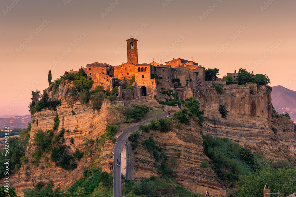 CIVITA DI BAGNOREGIO, ITALY, 7 AUGUST 2021 Beautiful view of the ghost town at sunset