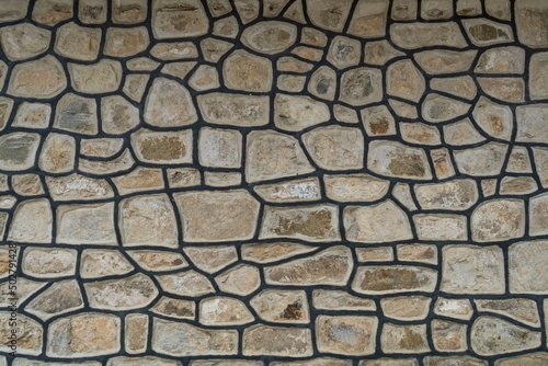 A wall of stones outlined with black lines,background,textur