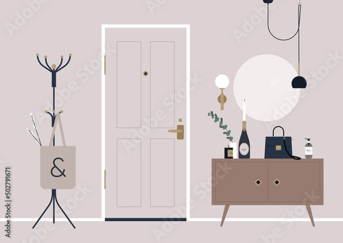 A decorated apartment entryway, a coat rack, and a mirror on the wall
