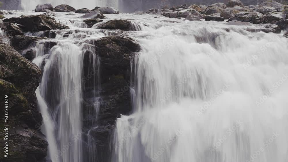 Whitewater is cascading over the dark rocks at the Storfossen waterfall. Long exposure, slow shutter. Whitewater is cascading over the dark rocks at the Storfossen waterfall. Long exposure, slow shutter.