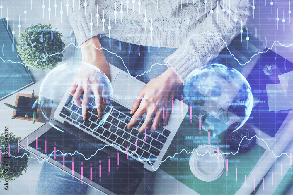 Double exposure of woman hands working on computer and forex chart hologram drawing. Top View. Financial analysis concept. Double exposure of woman hands working on computer and forex chart hologram drawing. Top View. Financial analysis concept.