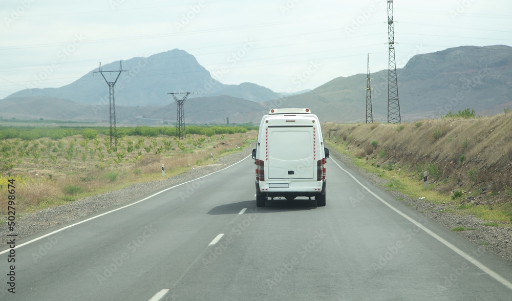 Delivery van driving in the road. Delivery van driving in the road.