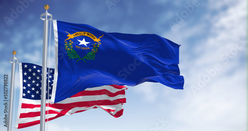 The Nevada state flag waving along with the national flag of the United States of America