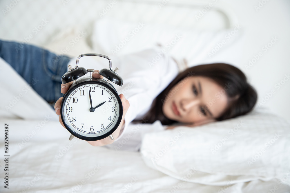 Insomnia in beautiful women. An Asian woman tries to sleep but she cannot sleep because she has anxiety and stress from hard work. Psychiatric care and medication from a doctor Insomnia in beautiful women. An Asian woman tries to sleep but she cannot sleep because she has anxiety and stress from hard work. Psychiatric care and medication from a doctor