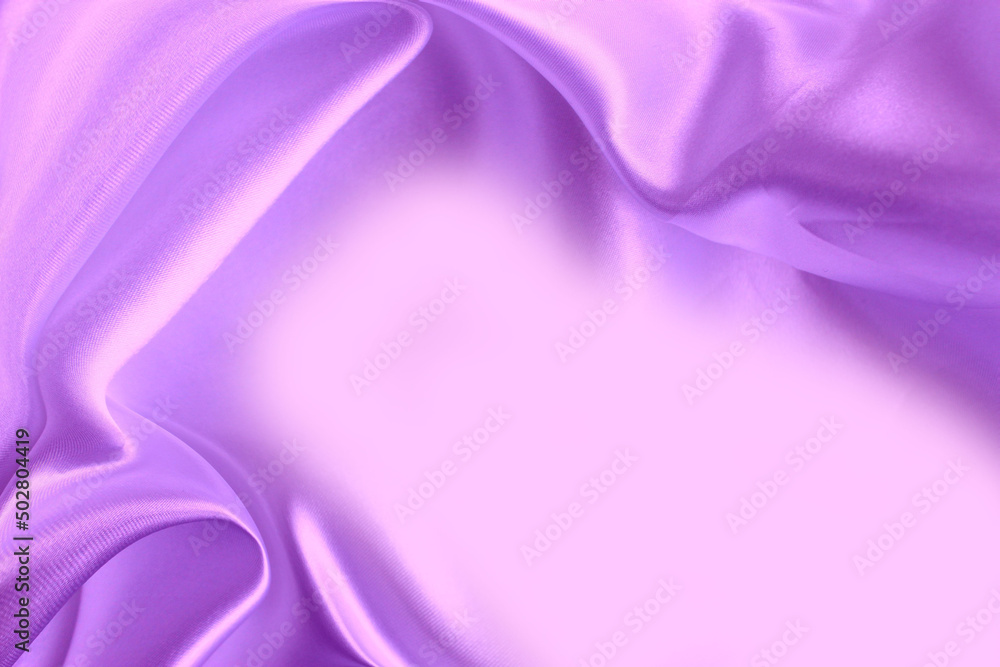 Obraz premium Silk lilac fabric with beautiful pleats solid background.