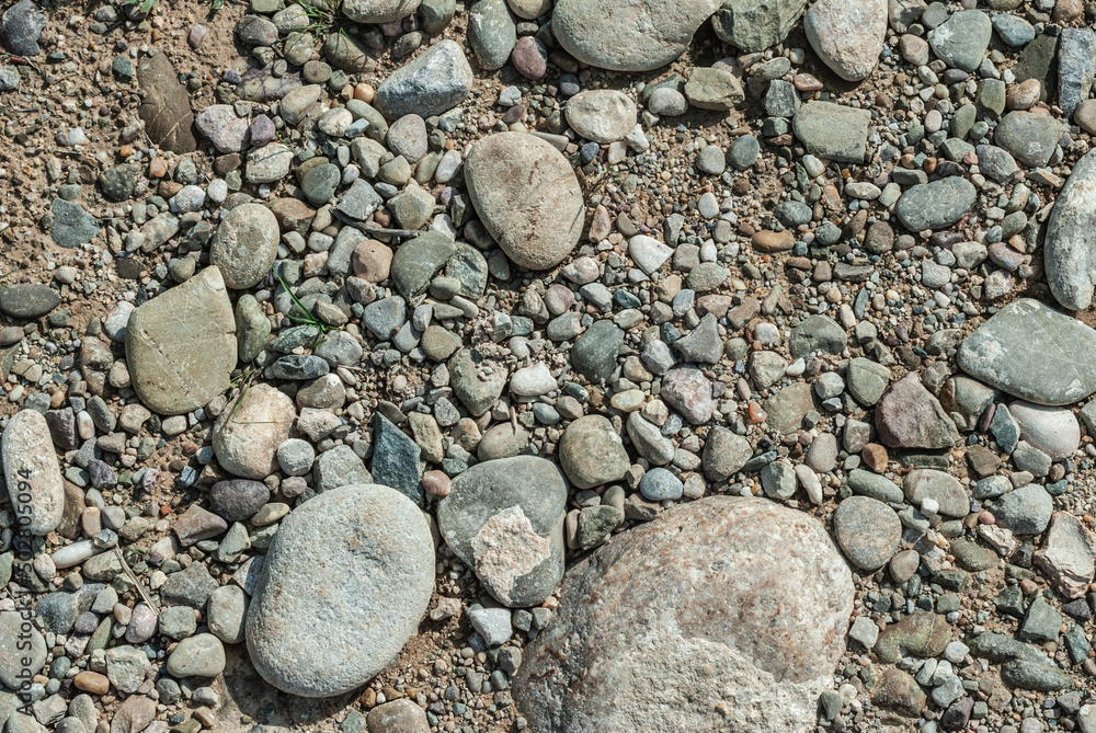 Dirt road with small stones background and texture concept Dirt road with small stones background and texture concept