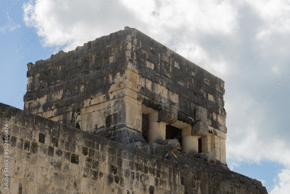 Top of the temple on the pok ta pok field, Chichen Itza, Mexico. Place of sacrifice. Temple of the Beared Man against the background of a cloudy sky.