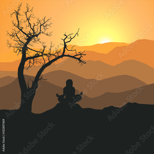 silhouette of a tree and woman in meditation pose in the sunset
