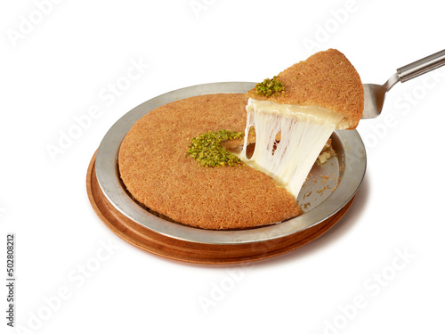 Traditional Eastern dessert with cheese inside called Kunefe photo