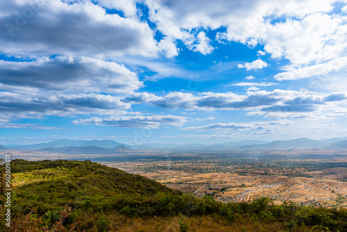 View of the valley of Oaxaca from the archaeological zone of Monte Alban sky with clouds and clear