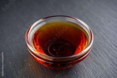 fragrant fish sauce on a black stone background