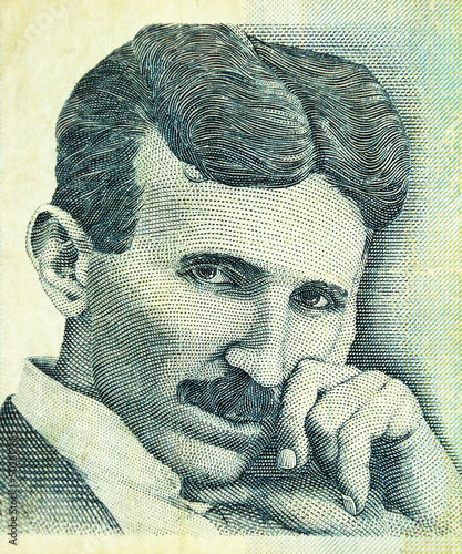 Portrait of Nikola Tesla, famous serbian scientist, engraving on old banknote of the bank of Serbia photo