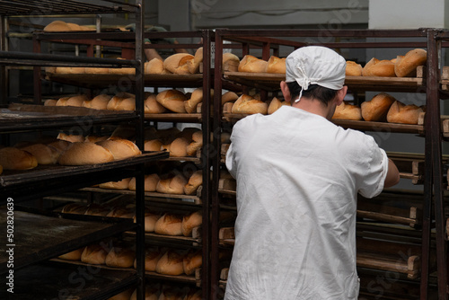 Warehouse of bread. Bakery products. A man is a bread baker. Bakery.